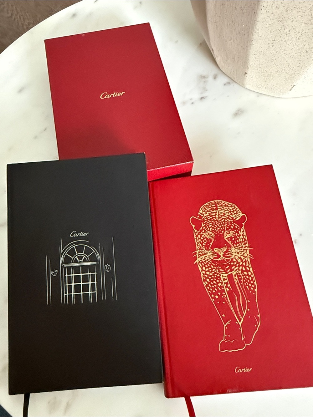 Cartier Red and Black Hardcover Notebooks with Gold Accents